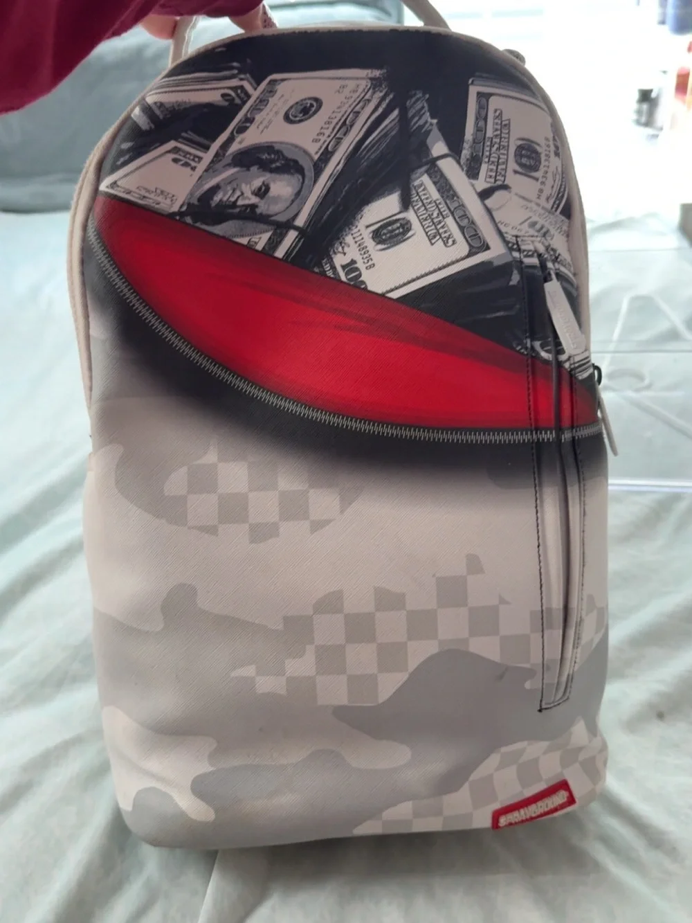 Sprayground Grey Camo Backpack with Red Zip Accent